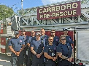 Carrboro Fire-Rescue Department Firefighters in Pink Shirts for Breast Cancer Awareness